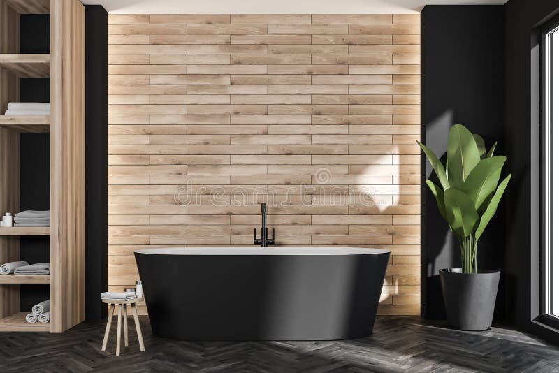 Oval balck bathtub in modern bathroom with wood look tiles