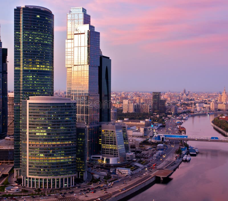 Skyscrapers over city at sunset. Skyscrapers over city at sunset