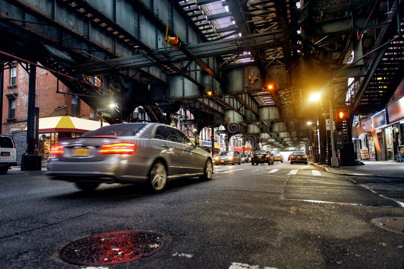 Above ground subway line and New York City street in Brooklyn with cars. City background. Above ground subway line and New York City street in Brooklyn with cars. City background.
