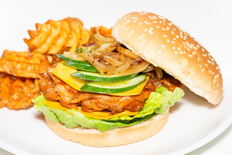 Chicken Burger with Criss Cross Fries on White Plate Stock Photo