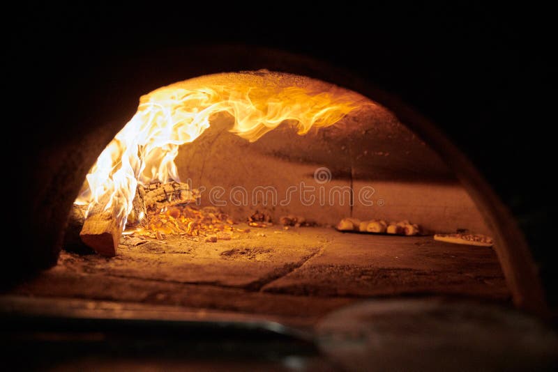 Oven with fire a wood logs burning royalty free stock photos