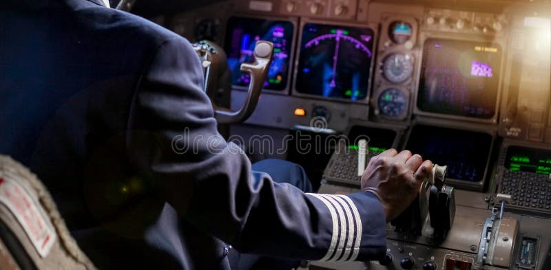 Over the Shoulder of an African Pilot in a Cockpit royalty free stock photos