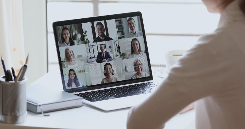 Business woman remote worker video conferencing colleagues by group videocall