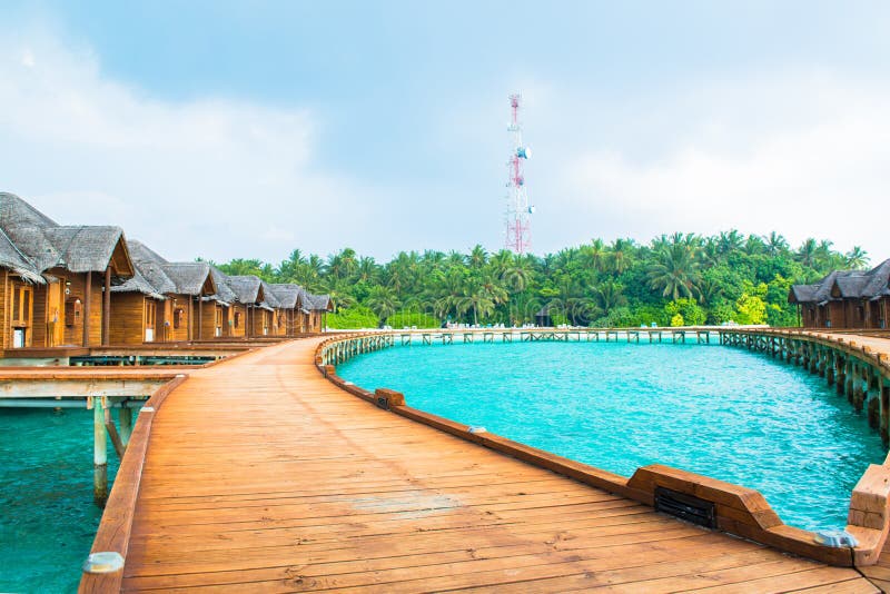 Over water bungalows with steps into amazing green lagoon