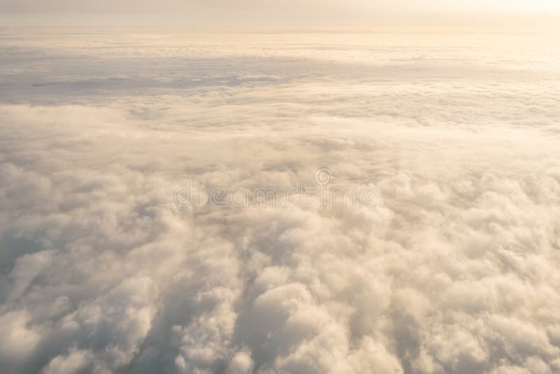 Overcast cloud cloudscape with height flight level of the airplane, smooth uniform texture of white steam before of the sunset. Airplane height stock images, royalty-free photos and pictures