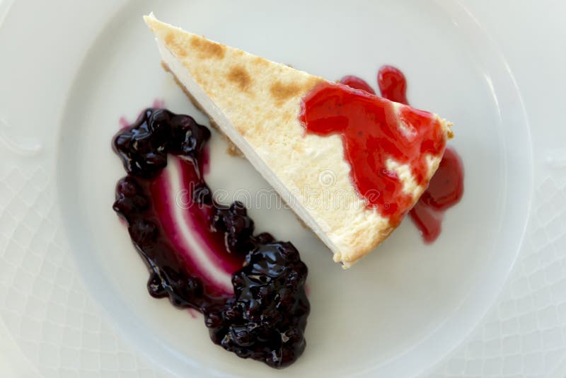 Overhead Close Up of Slice of Cheesecake with Blueberry Jam Stock Photo Image of closeup