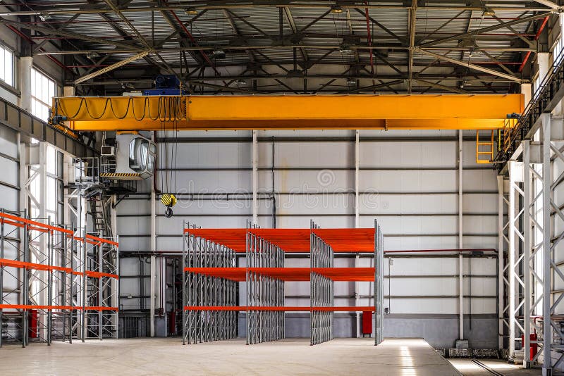 Overhead crane in a empty industrial warehouse building