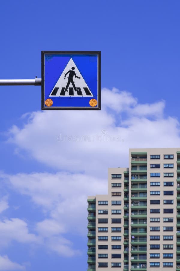 Overhead Electric Pedestrian Crossing Sign with Blurred Residential ...