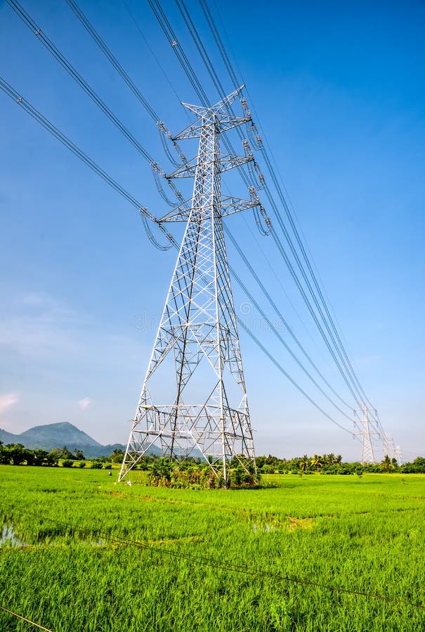 Overhead eletrical transmission line crossing the rice field at Philippine countryside