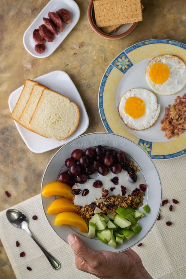 Overhead Shot of a Breakfast Spread Composed of Eggs, Fruits, Bread