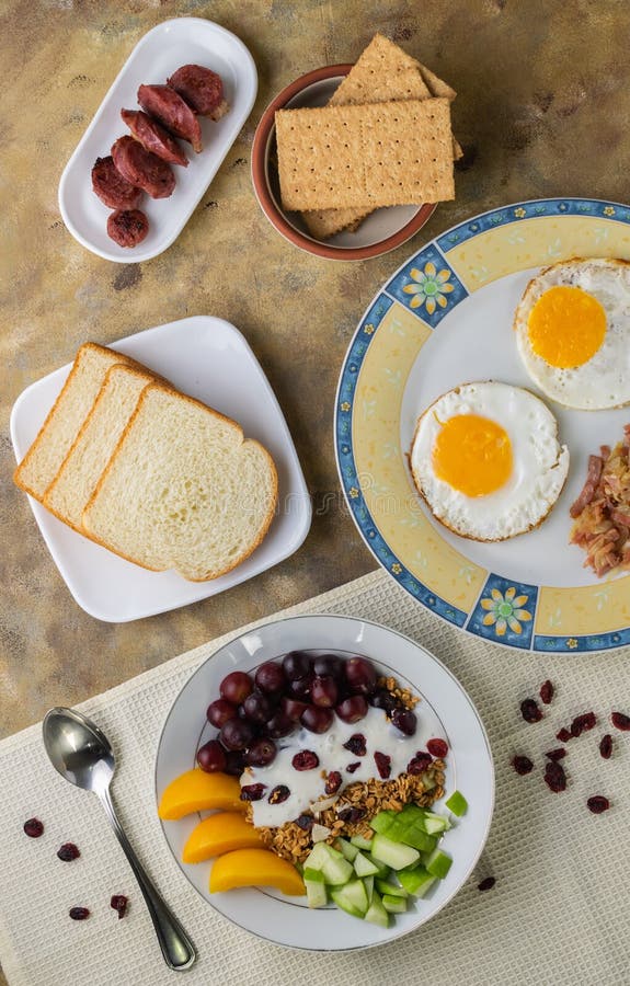 Overhead Shot of a Breakfast Spread Composed of Eggs, Fruits, Bread