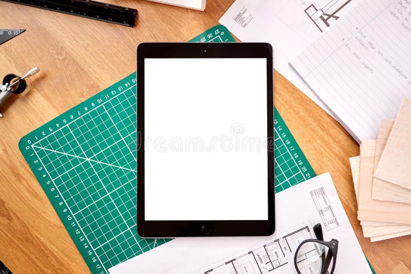 Overhead Shot Of Desk In Architects Office With Plans Drawing Instruments And Digital Tablet stock image
