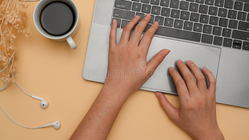A female working on laptop computer, typing on notebook keyboard royalty free stock photo