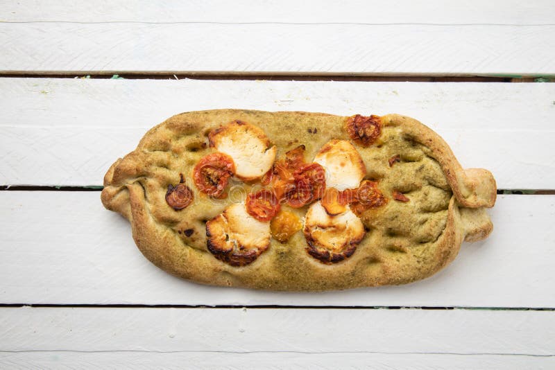 Overhead shot of an nontraditional shaped crispy pizza royalty free stock photos