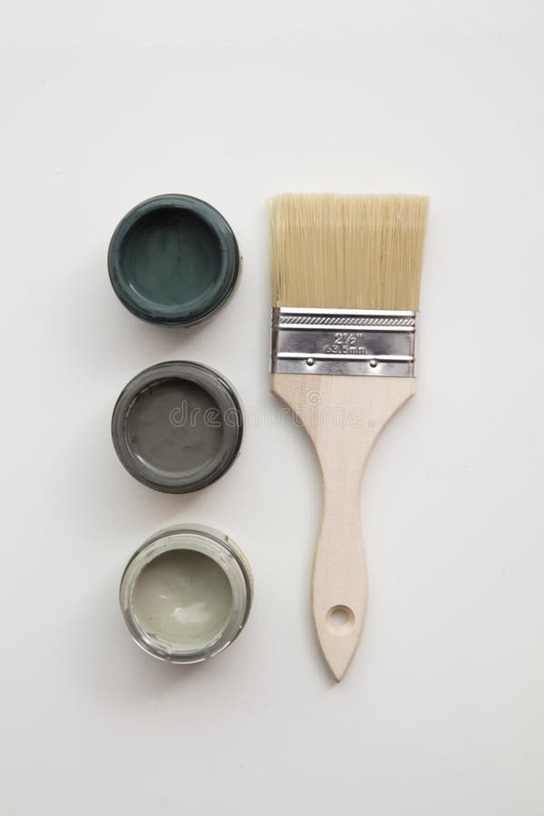 Overhead View of a DIY Paint Brush with Trendy Green Sample Paint Pots