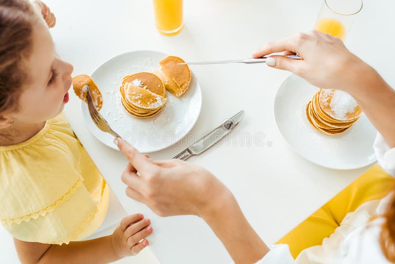 Dad and Daughter Eat Pancakes and Spend Time Together Stock Image