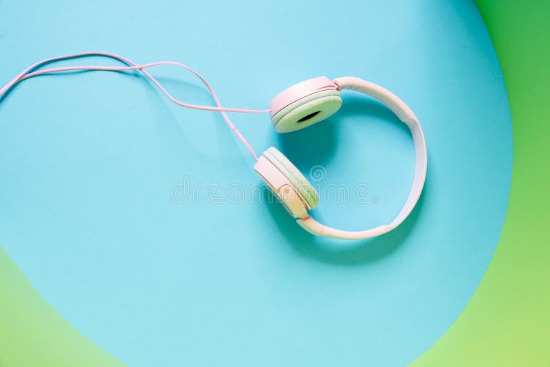 Overhead View of a Pink Wired Headphones Lying in the Studio Stock