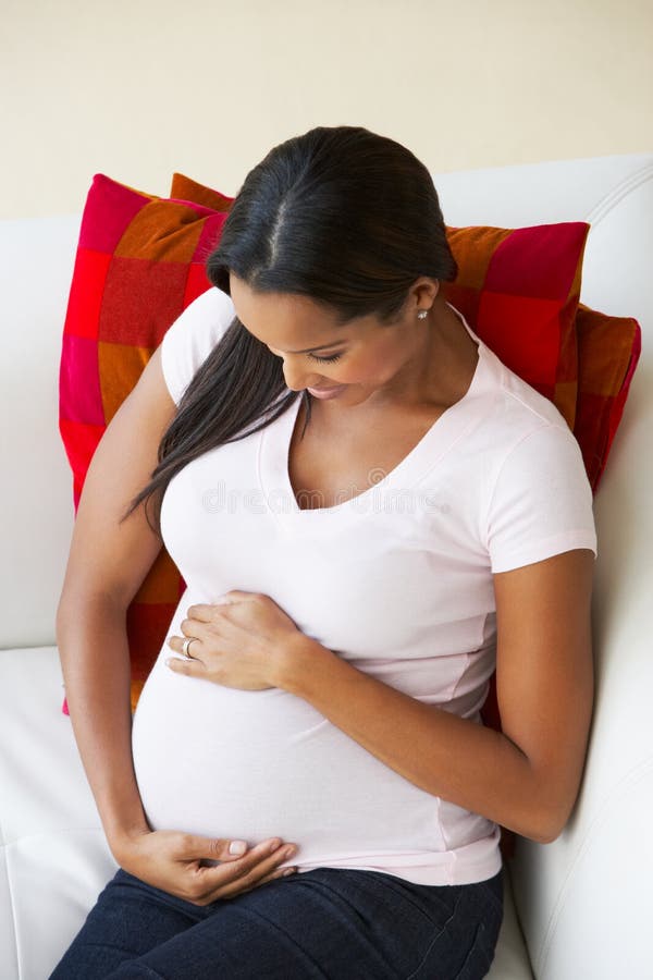 Overhead View of Pregnant Woman Relaxing on Sofa Stock Image Image of