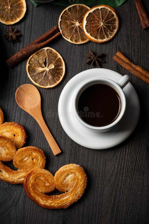 Overhead View of Puff Pastry Sweets with Cup of Coffee, Dried Oranges