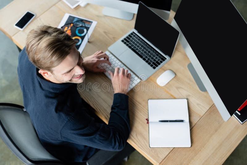 Overhead View of Smiling Developer Using Stock Image Image of