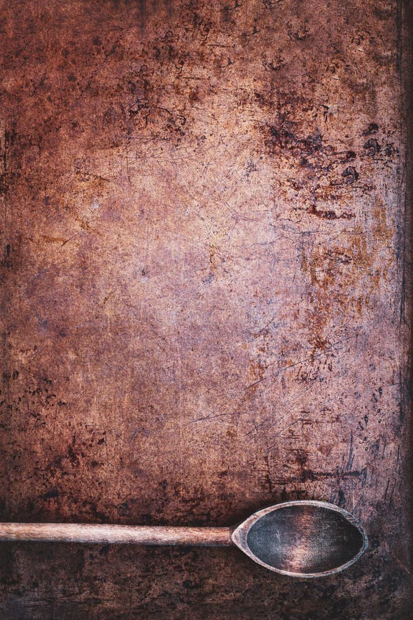 Wood Spoon over Scratched Grunge Copper Background with Vignetting royalty free stock photo Wood Spoon over Scratched Grunge Copper Background with Vignetting royalty free stock photo
