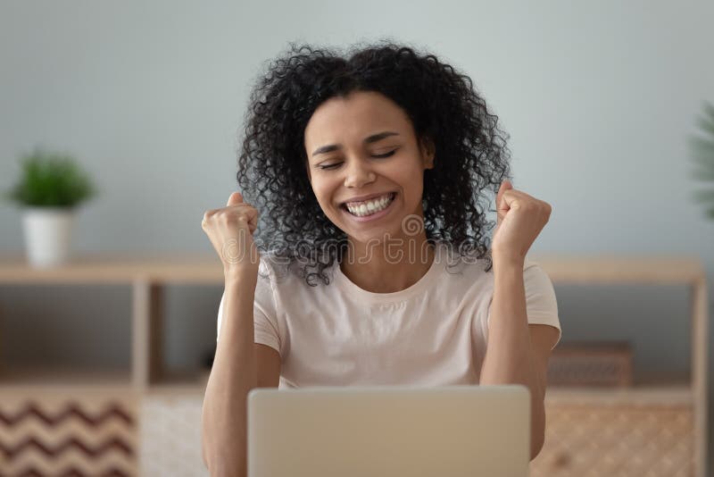 Overjoyed happy african girl student celebrate great exam results royalty free stock photography Overjoyed happy african girl student celebrate great exam results royalty free stock photography