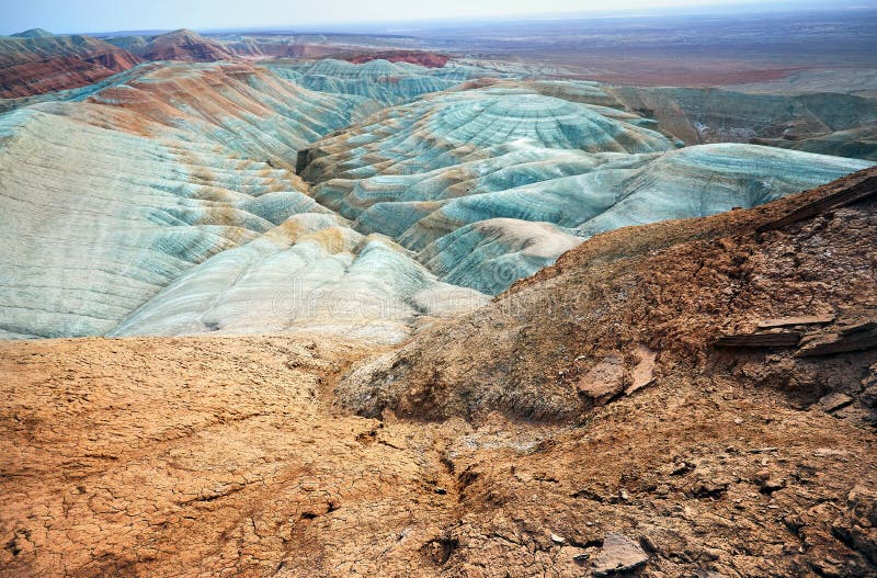 Bizarre layered blue and red mountains in desert park Altyn Emel in Kazakhstan. Bizarre layered blue and red mountains in desert park Altyn Emel in Kazakhstan