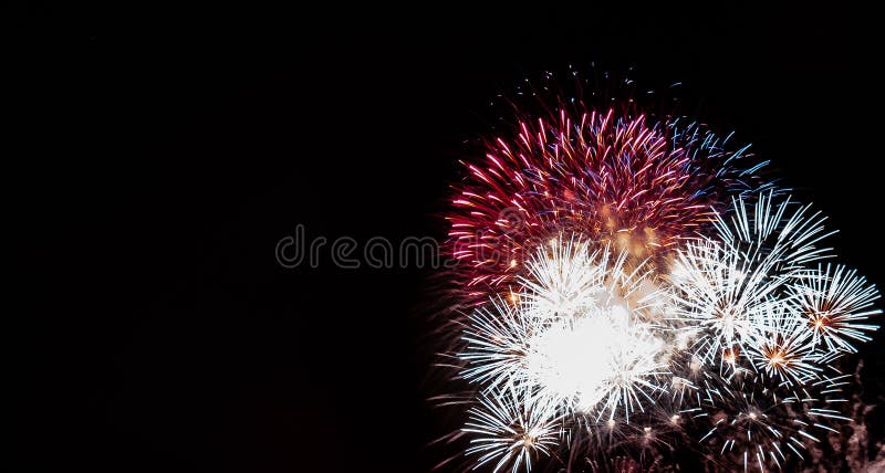 Overlapping large red, white,and blue starburst fireworks with a black background. Overlapping exploding fireworks stock images, royalty-free photos and pictures