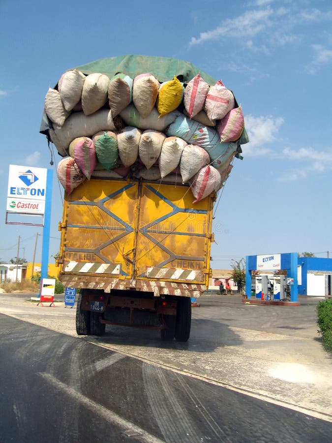 Premium AI Image  Overloaded truck with goods jutting out