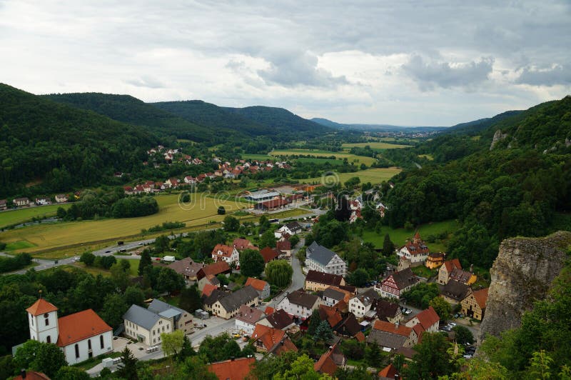 Colorful historic city in a green valley characterized by a river and fields in a karst landscape. royalty free stock photos Colorful historic city in a green valley characterized by a river and fields in a karst landscape. royalty free stock photos