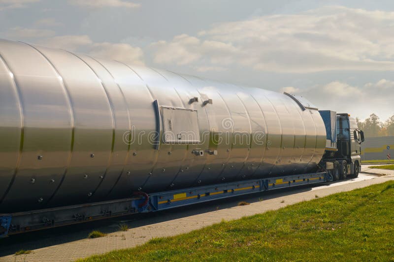 Oversize Load or exceptional convoy. A truck with a special semi-trailer for transporting oversized loads royalty free stock image Oversize Load or exceptional convoy. A truck with a special semi-trailer for transporting oversized loads royalty free stock image