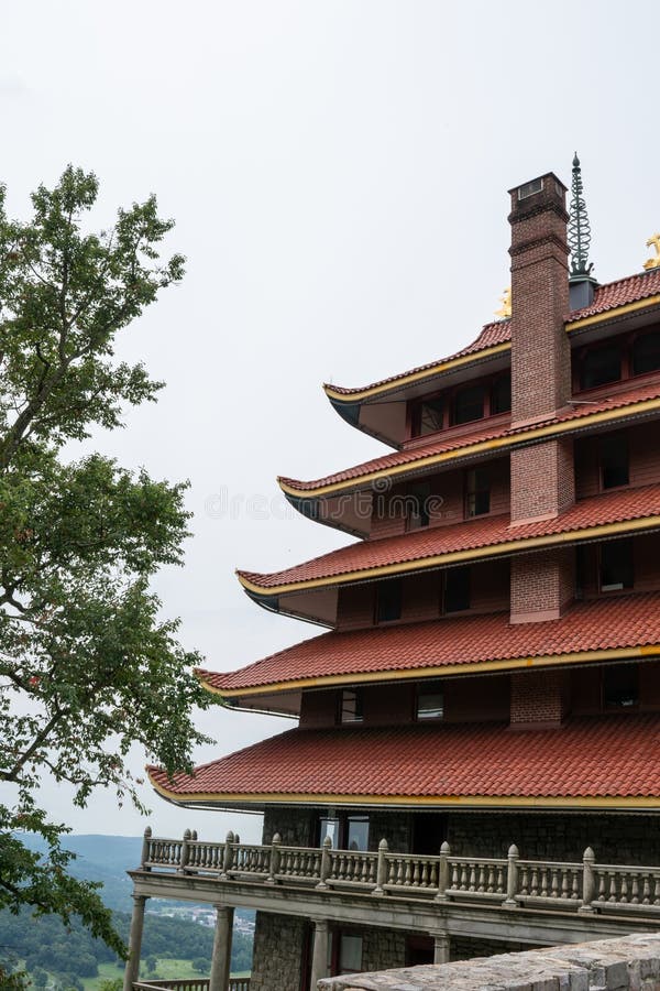 Overview of an Asian Pagoda looking over a forest and city. stock photos