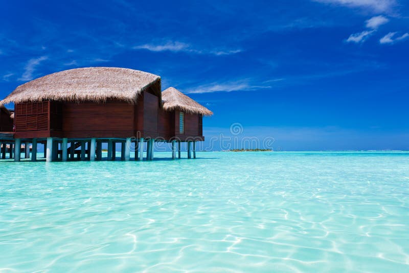 Overwater bungalow in tropical lagoon