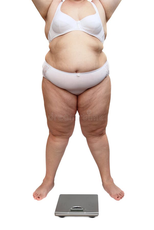 Overweight woman body and scales stock photos