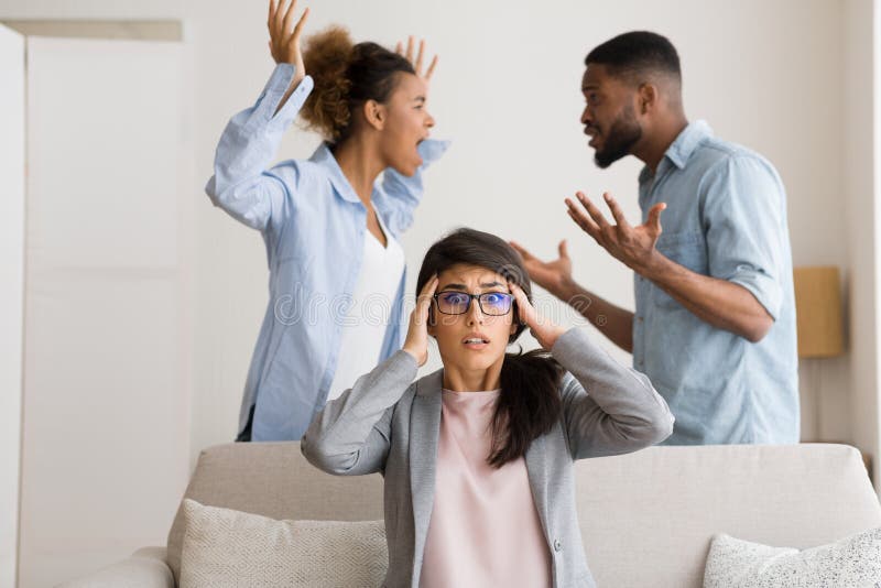 Overwhelmed Couples Therapist Witnessing Afro Patients Fighting In Office stock image Overwhelmed Couples Therapist Witnessing Afro Patients Fighting In Office stock image