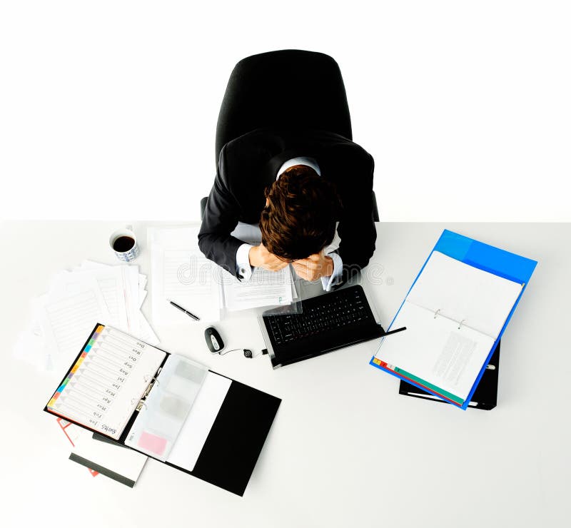 Overwhelmed worker at his desk