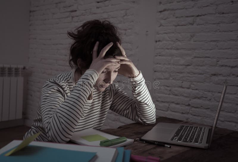 Close up portrait of a overworked and tired young woman studying royalty free stock image Close up portrait of a overworked and tired young woman studying royalty free stock image