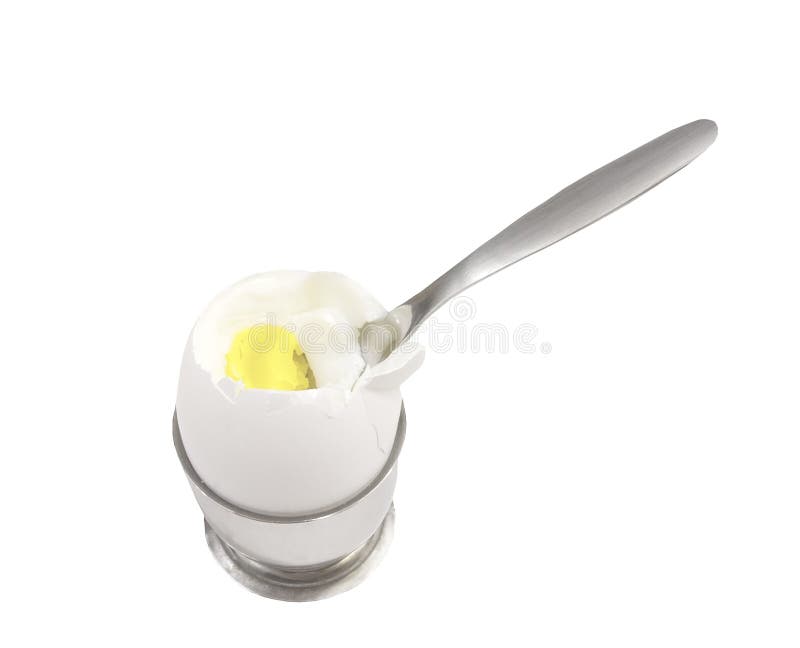Fresh boiled egg cracked open in a egg cup with spoon on a white background. Fresh boiled egg cracked open in a egg cup with spoon on a white background