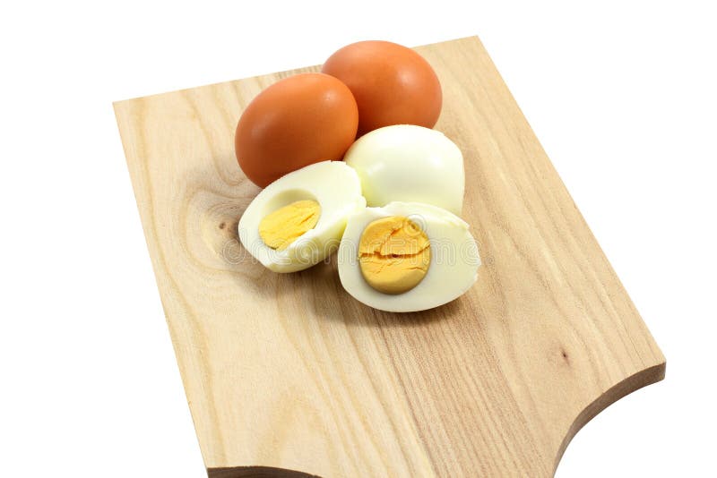 Hard-boiled eggs on wooden chopping board. Hard-boiled eggs on wooden chopping board
