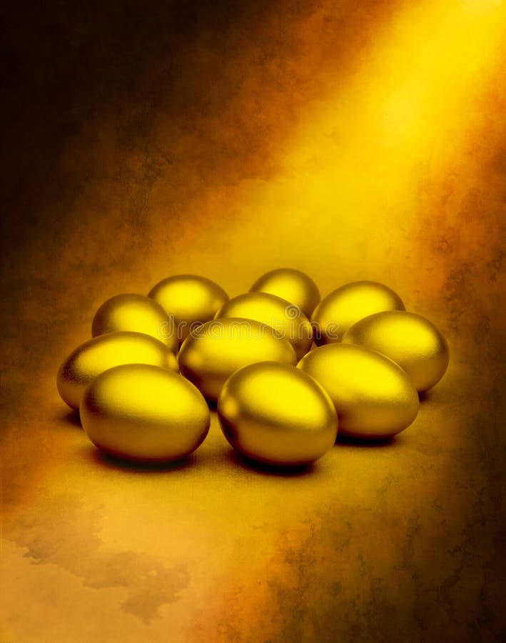 Gold eggs on an abstract background with a golden shaft of light. Gold eggs on an abstract background with a golden shaft of light