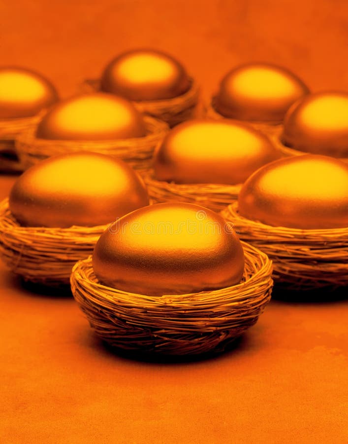 Gold eggs in many baskets with a golden background implying a diversified wealth portfolio. Gold eggs in many baskets with a golden background implying a diversified wealth portfolio