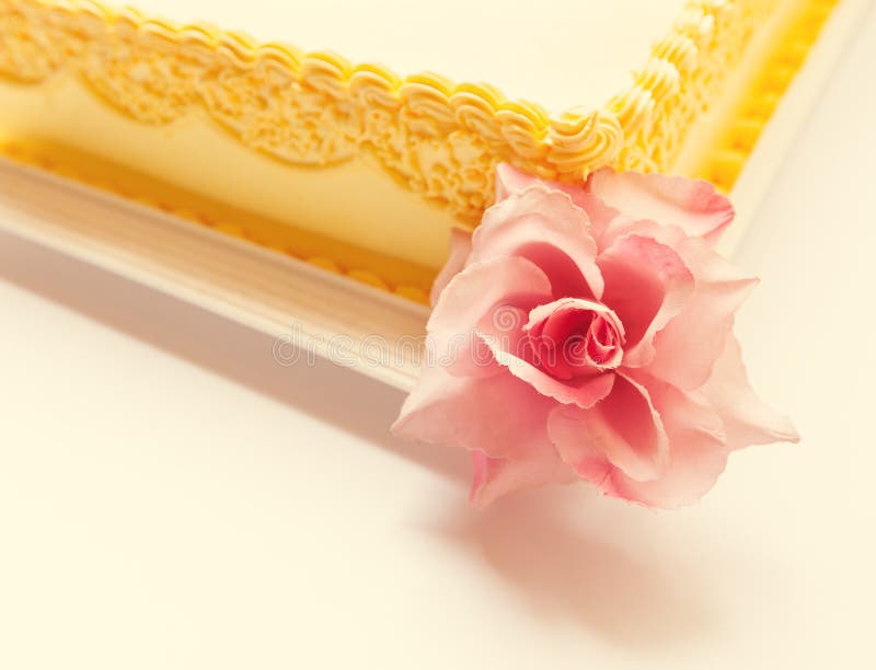 Owl Birthday Cake. Yellow birthday cake with pink owl of sugar on the top royalty free stock photography Owl Birthday Cake. Yellow birthday cake with pink owl of sugar on the top royalty free stock photography