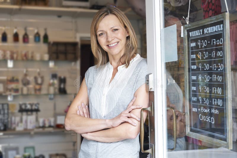 Owner Of Gift Shop Standing In Doorway royalty free stock image Owner Of Gift Shop Standing In Doorway royalty free stock image