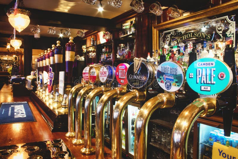 Oxford, UK - 02 March 2020: Rows of draught beer in a typical British pub royalty free stock photography