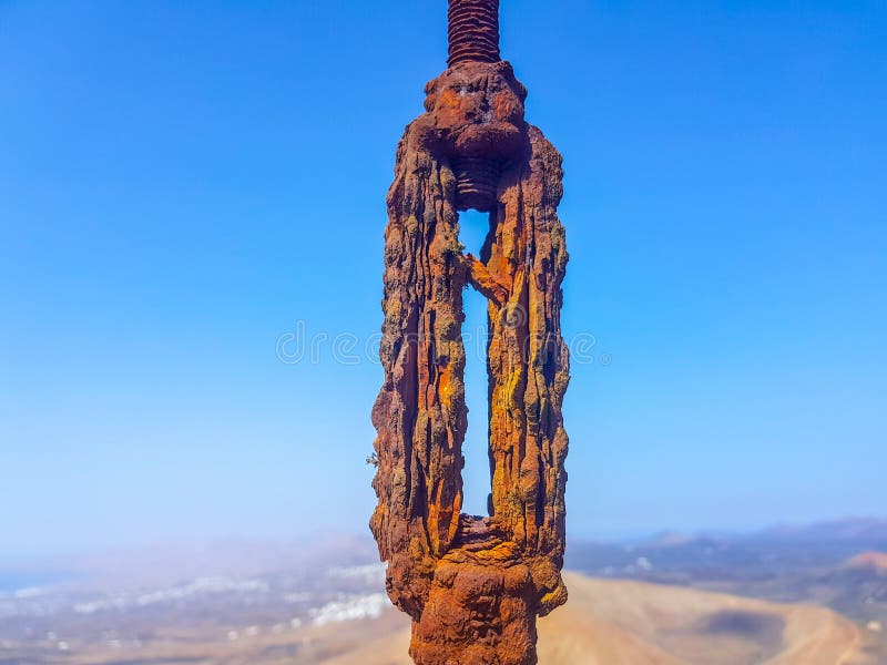 Oxidized Interlocked Wire Loop Cables in the Foreground with Sky and