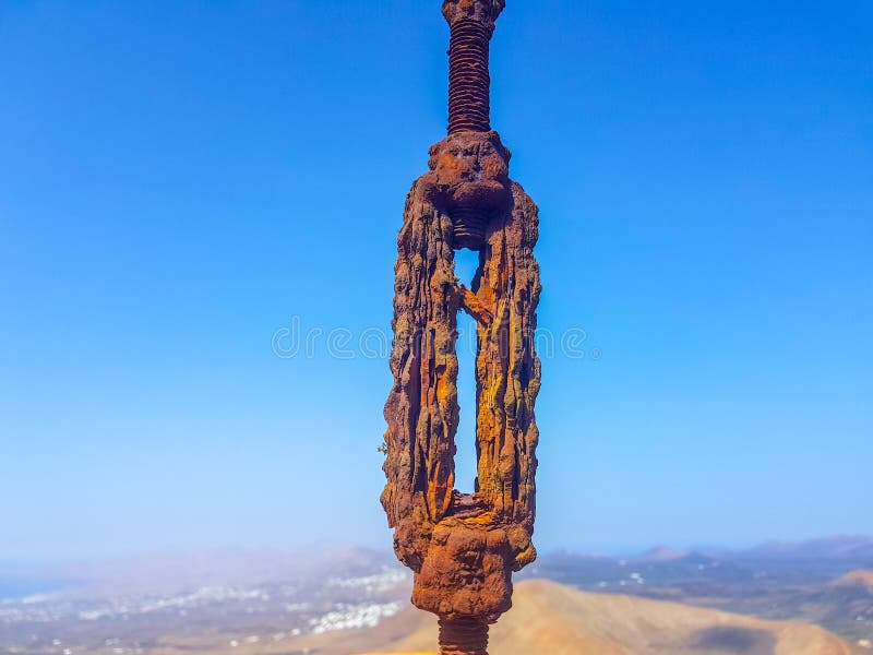 Oxidized Interlocked Wire Loop Cables in the Foreground with Sky and