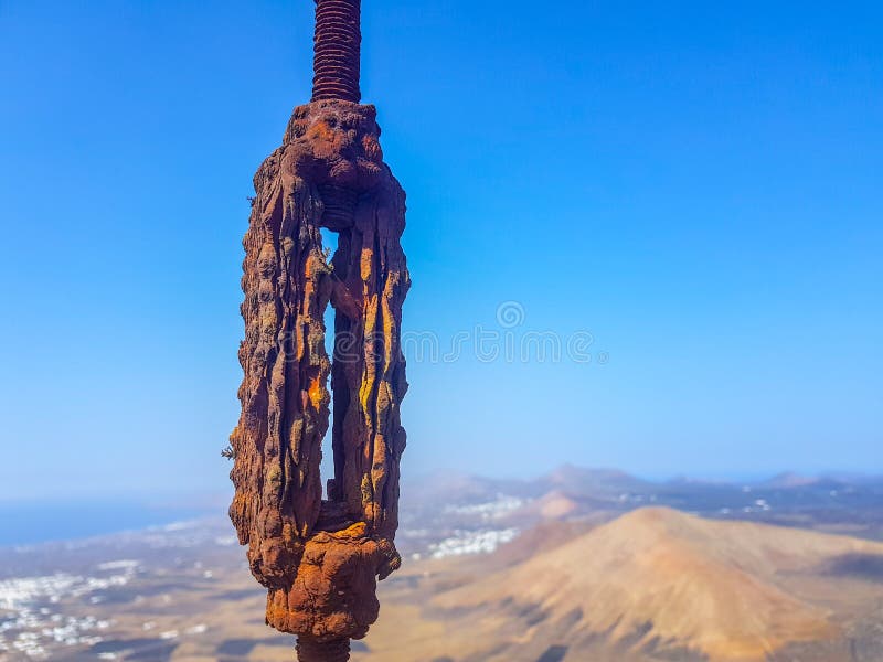 Oxidized Interlocked Wire Loop Cables in the Foreground with Sky and