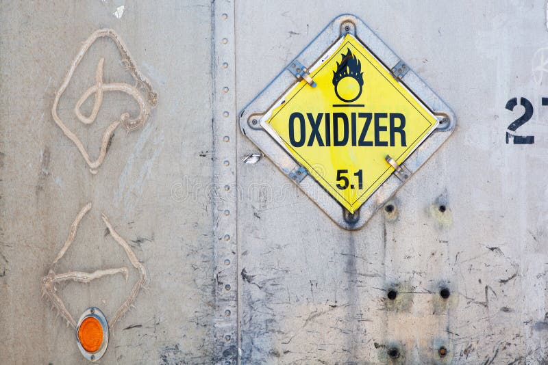 Oxidizer placard on decayed metal container