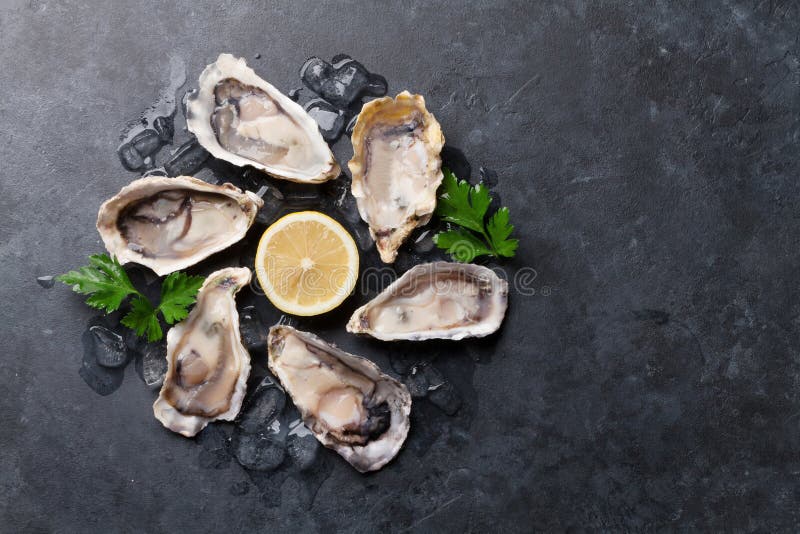 Oysters and lemon royalty free stock image