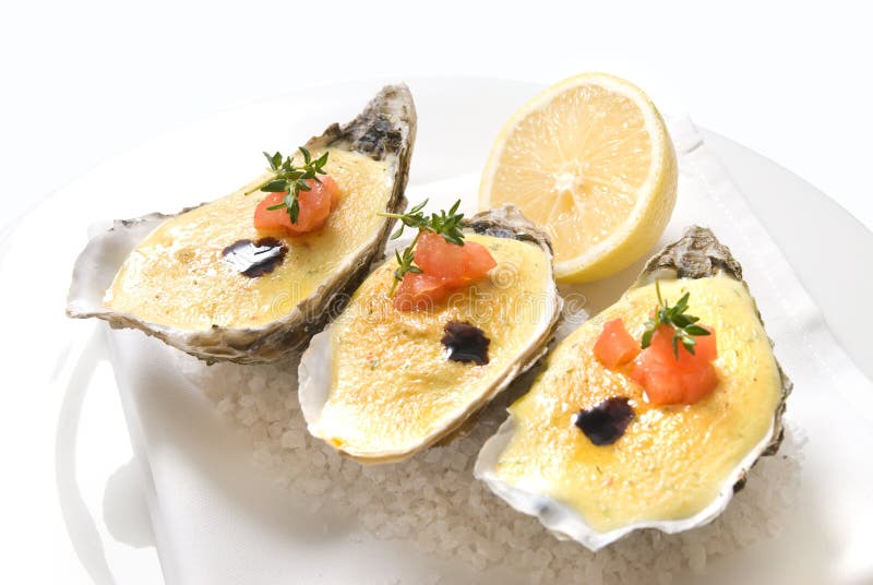 Oysters with sauce and lemon